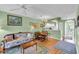 Comfortable living room with hardwood floors that opens to the kitchen at 4650 Greenbriar Dr. # A5, Little River, SC 29566