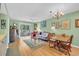 Spacious living room with hardwood floors and sliding glass doors to the patio at 4650 Greenbriar Dr. # A5, Little River, SC 29566