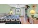 Cozy main bedroom featuring a queen bed, ceiling fan, and flat-screen TV at 4650 Greenbriar Dr. # A5, Little River, SC 29566