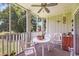 Comfortable screened-in porch featuring seating, plants, and a relaxing space to enjoy the outdoors at 4650 Greenbriar Dr. # A5, Little River, SC 29566