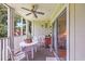 Cozy screened porch with outdoor seating and a slider door entry to the living space at 4650 Greenbriar Dr. # A5, Little River, SC 29566