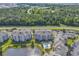 Aerial image of a condo complex featuring lush greenery, a lake, a pool, and convenient parking, providing scenic views at 4821 Luster Leaf Circle # 202, Myrtle Beach, SC 29577