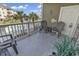 A cozy condo balcony with seating and beachy decor overlooking a community pool, inviting outdoor enjoyment at 4821 Luster Leaf Circle # 202, Myrtle Beach, SC 29577