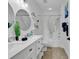 Bright bathroom features a double vanity, shower with tub, coastal decor, and round mirror at 4821 Luster Leaf Circle # 202, Myrtle Beach, SC 29577