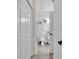 Bright bathroom featuring a modern vanity, round mirror, frosted glass shower, and coastal-themed decor at 4821 Luster Leaf Circle # 202, Myrtle Beach, SC 29577