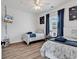 Bedroom featuring twin beds with blue accents, coastal decor, ceiling fan, and natural light at 4821 Luster Leaf Circle # 202, Myrtle Beach, SC 29577