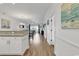 Hallway with wood floors leading to the living spaces providing an open-concept living experience at 4821 Luster Leaf Circle # 202, Myrtle Beach, SC 29577