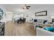 Open-concept living area connects dining and living spaces with bright natural light at 4821 Luster Leaf Circle # 202, Myrtle Beach, SC 29577