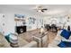 Open-concept living space featuring wood floors, a ceiling fan and easy access to the dining and kitchen areas at 4821 Luster Leaf Circle # 202, Myrtle Beach, SC 29577