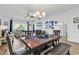 Bright living room features wood floors, ample seating, and décor accents and a spacious dining area at 4821 Luster Leaf Circle # 202, Myrtle Beach, SC 29577