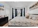 Bright primary bedroom with a large bay window and neutral decor at 4821 Luster Leaf Circle # 202, Myrtle Beach, SC 29577