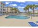 A community swimming pool surrounded by lounge chairs and well-maintained landscaping, ideal for relaxation and recreation at 4821 Luster Leaf Circle # 202, Myrtle Beach, SC 29577