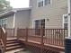 Back deck featuring a wooden railing and steps to access the yard, providing space for outdoor enjoyment at 4840 Moss Creek Loop # 31, Murrells Inlet, SC 29576