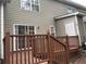 Back deck featuring a wooden railing and steps to access the yard, providing space for outdoor enjoyment at 4840 Moss Creek Loop # 31, Murrells Inlet, SC 29576