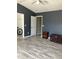 Large bedroom featuring hardwood floors, neutral paint, and ample space for furniture at 4840 Moss Creek Loop # 31, Murrells Inlet, SC 29576