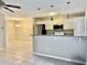 Open kitchen with granite countertops, stainless steel appliances, and bar seating, great for entertaining at 4840 Moss Creek Loop # 31, Murrells Inlet, SC 29576