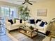 Cozy living room with neutral tones, comfortable seating, and sliding doors to the backyard at 4840 Moss Creek Loop # 31, Murrells Inlet, SC 29576
