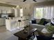 Open concept living area featuring an eat-in kitchen, ample seating, and natural light at 4840 Moss Creek Loop # 31, Murrells Inlet, SC 29576