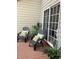 Cozy patio with outdoor seating and sliding glass doors, perfect for relaxing or entertaining at 4840 Moss Creek Loop # 31, Murrells Inlet, SC 29576