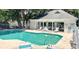 Community pool with lounge chairs and covered area, ideal for summer relaxation and recreation at 4840 Moss Creek Loop # 31, Murrells Inlet, SC 29576