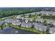 Scenic aerial view of the condos, lake, trees, golf course and cityscape in the distance at 4887 Luster Leaf Circle # 104, Myrtle Beach, SC 29572