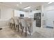 Kitchen with bar seating, stainless steel appliances, and white cabinetry at 4887 Luster Leaf Circle # 104, Myrtle Beach, SC 29572