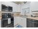 Clean and well-lit kitchen featuring stainless steel appliances and white cabinetry at 4887 Luster Leaf Circle # 104, Myrtle Beach, SC 29572