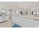 Open living space showcasing the kitchen counter, and view to dining and living area at 4887 Luster Leaf Circle # 104, Myrtle Beach, SC 29572