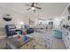 Bright and open living space with tile floors, ceiling fan, stylish furnishings, and an open concept design at 4887 Luster Leaf Circle # 104, Myrtle Beach, SC 29572