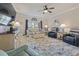 Bright living room with comfortable seating, ceiling fan, and view of the outside at 4887 Luster Leaf Circle # 104, Myrtle Beach, SC 29572