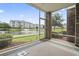 Screened-in porch overlooking a serene pond and well-maintained landscaping at 4887 Luster Leaf Circle # 104, Myrtle Beach, SC 29572