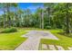 Well-maintained backyard featuring a patio and lush landscaping at 496 Starlit Way, Myrtle Beach, SC 29579