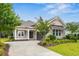 Charming single-story home featuring a well-manicured lawn, stylish porch, and attached garage at 496 Starlit Way, Myrtle Beach, SC 29579