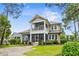 Exterior view of a two-story home featuring a front-facing balcony at 496 Starlit Way, Myrtle Beach, SC 29579