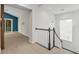 Second floor hallway featuring railing and neutral colors with natural light from the window at 496 Starlit Way, Myrtle Beach, SC 29579