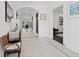 Bright hallway featuring tiled floors, decorative lighting, and access to various rooms at 496 Starlit Way, Myrtle Beach, SC 29579