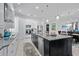 Modern kitchen with granite countertops, stainless steel appliances, and a spacious center island at 496 Starlit Way, Myrtle Beach, SC 29579