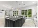 Spacious kitchen with modern features flows into living area, with lots of room at 496 Starlit Way, Myrtle Beach, SC 29579