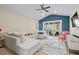 Open living room with a large sectional, ceiling fan, and sliding glass doors to the patio at 496 Starlit Way, Myrtle Beach, SC 29579