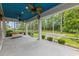Relaxing screened porch with ceiling fans and a view of the manicured backyard at 496 Starlit Way, Myrtle Beach, SC 29579