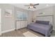 Bedroom featuring a large dresser and a padded headboard with a ceiling fan and window at 505 Chester St 5Th Ave. N, Myrtle Beach, SC 29577