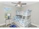 Bedroom featuring a bunk bed with blue patterned bedding, offering a cozy space at 505 Chester St 5Th Ave. N, Myrtle Beach, SC 29577