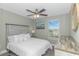 Bedroom with whitewashed wood furniture and a view of trees outside the window at 505 Chester St 5Th Ave. N, Myrtle Beach, SC 29577