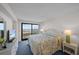 Bright bedroom featuring ocean views, wicker furniture and a comfortable bed at 523 S Ocean Blvd. # 305, North Myrtle Beach, SC 29582