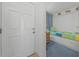 Peeking into a nautical-themed bedroom from the doorway, showcasing twin beds at 523 S Ocean Blvd. # 305, North Myrtle Beach, SC 29582