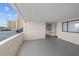 Outside hallway leading to unit's entrance with view of the parking garage at 523 S Ocean Blvd. # 305, North Myrtle Beach, SC 29582