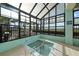 Indoor hot tub with ocean views through large windows at 523 S Ocean Blvd. # 305, North Myrtle Beach, SC 29582