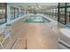 Bright indoor pool with lounge chairs and large windows at 523 S Ocean Blvd. # 305, North Myrtle Beach, SC 29582