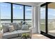 A cozy sitting area by a large window with views of the beach and ocean at 523 S Ocean Blvd. # 305, North Myrtle Beach, SC 29582
