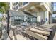 Outdoor pool deck with lounge chairs and tables near the indoor pool at 523 S Ocean Blvd. # 305, North Myrtle Beach, SC 29582